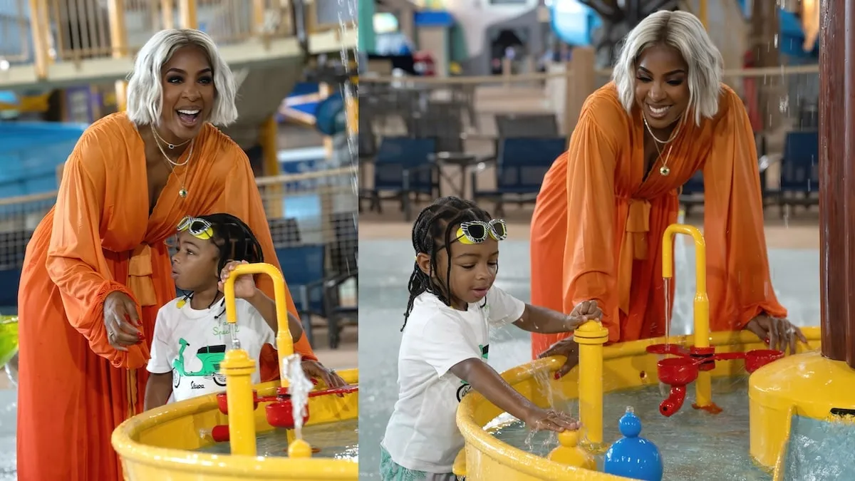 Wearing an orange kaftan, Kelly Rowland plays with her son Noah at Great Wolf Lodge water park