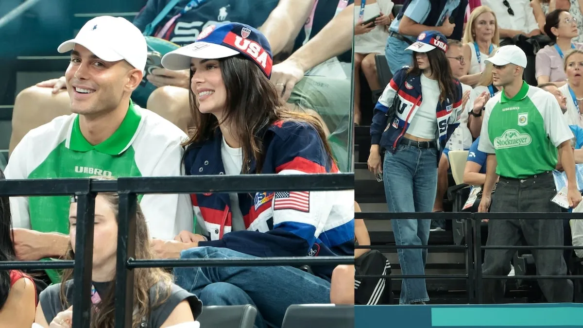 Fai Khadra in a green polo and Kendall Jenner in red white and blue cheer for the U.S. women's gymnastics team at the 2024 Summer Olympics