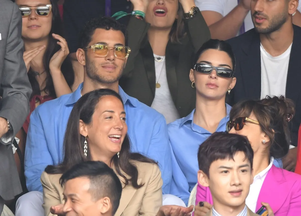 Models Fai Khadra and Kendall Jenner wears blue button-ups while watching Wimbledon together in 2019