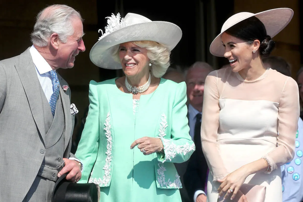 King Charles, who began 'showing off' at the mention of the Queen Mother, with Queen Camilla, and Meghan Markle.