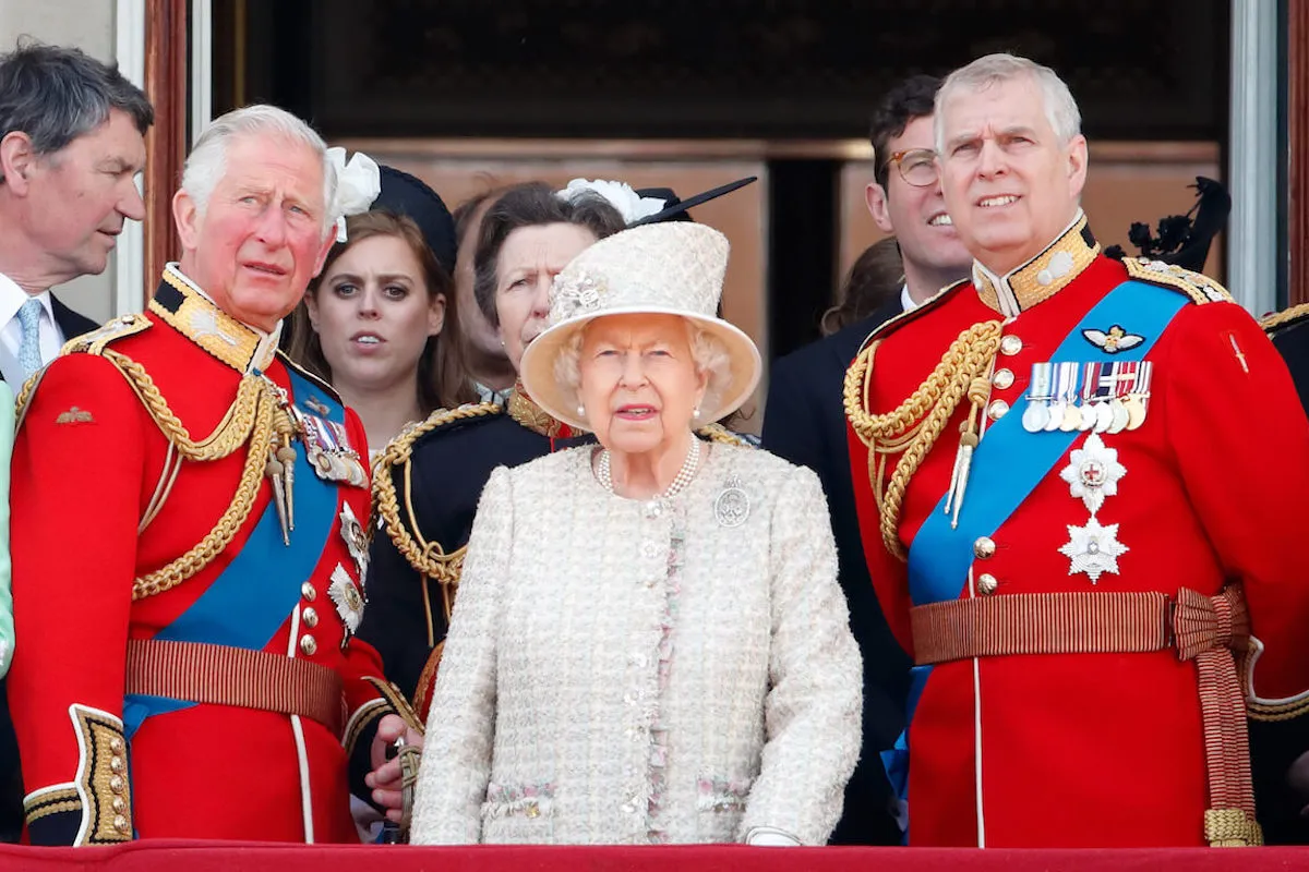 King Charles, Queen Elizabeth, and Prince Andrew, who is 'doomed' in Royal Lodge drama, stand next to each other.