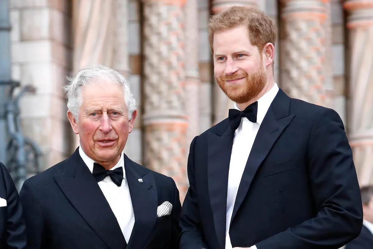 King Charles and Prince Harry, who both fear history repeating itself, pose together wearing suits and bow ties.