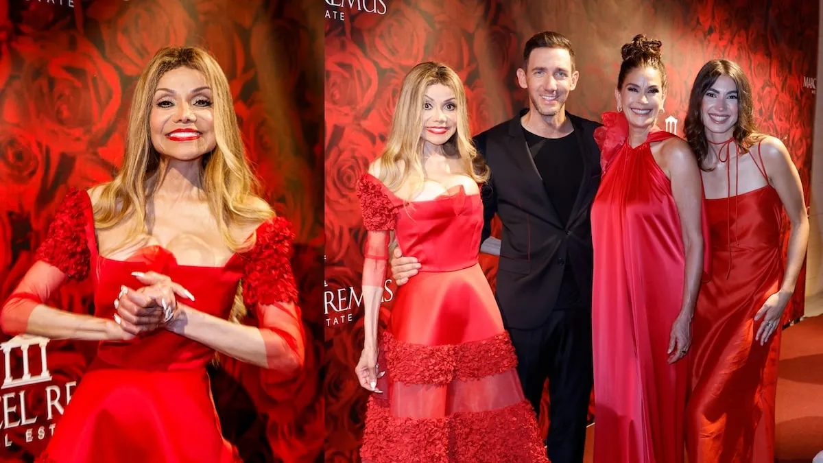 Wearing a red dress, La Toya Jackson smiles with party-goers in Mallorca, Spain