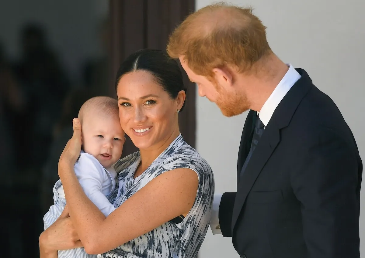 Prince Harry and Meghan Markle with their older child, Prince Archie