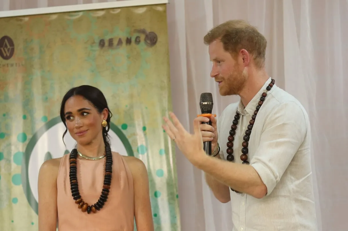 Meghan Markle and Prince Harry speak during visit to Lightway Academy with Meghan Markle in Abuja, Nigeria