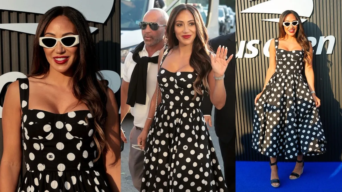 Wearing a black and white polka dot dress, Melissa Gorga waves to fans at the US Open