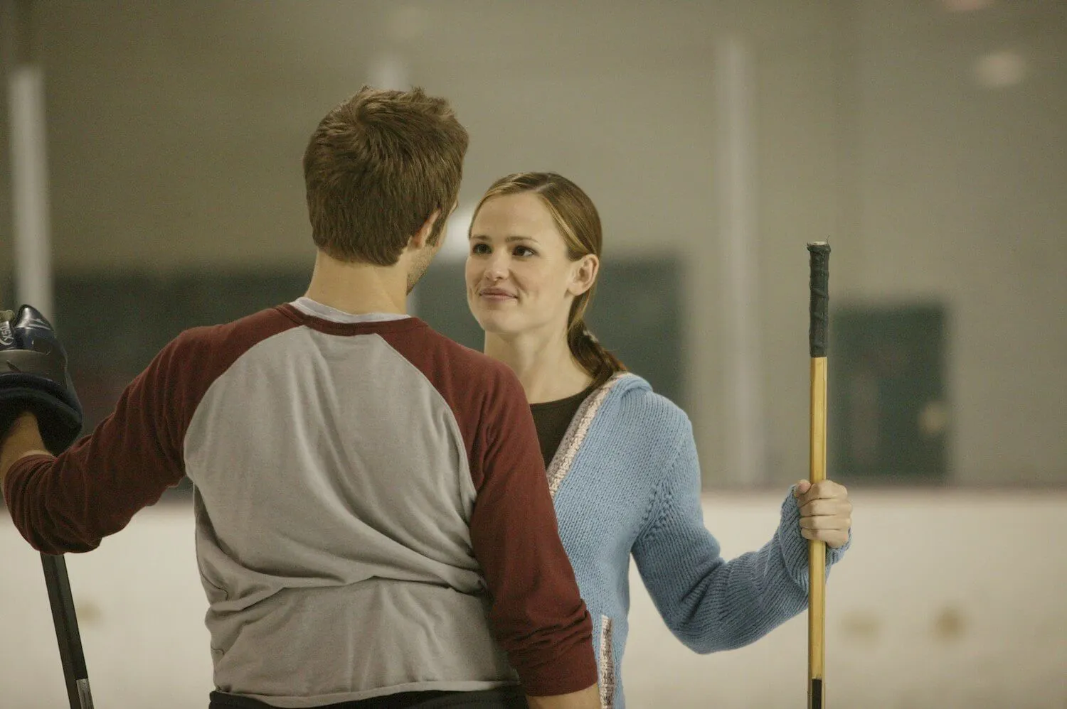 Michael Vartan and Jennifer Garner in 'Alias.' They're in an ice rink facing each other.