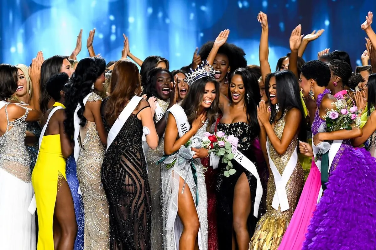 Alma Cooper Miss Michigan surrounded by fellow contestants after she wins Miss USA 2024