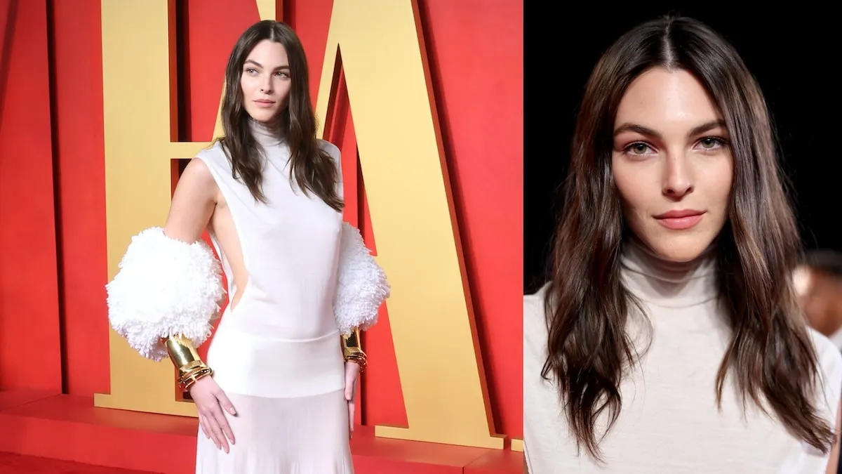 Wearing a white silk gown, Vittoria Ceretti poses for photos on the red carpet of the 2024 Vanity Fair Oscar Party