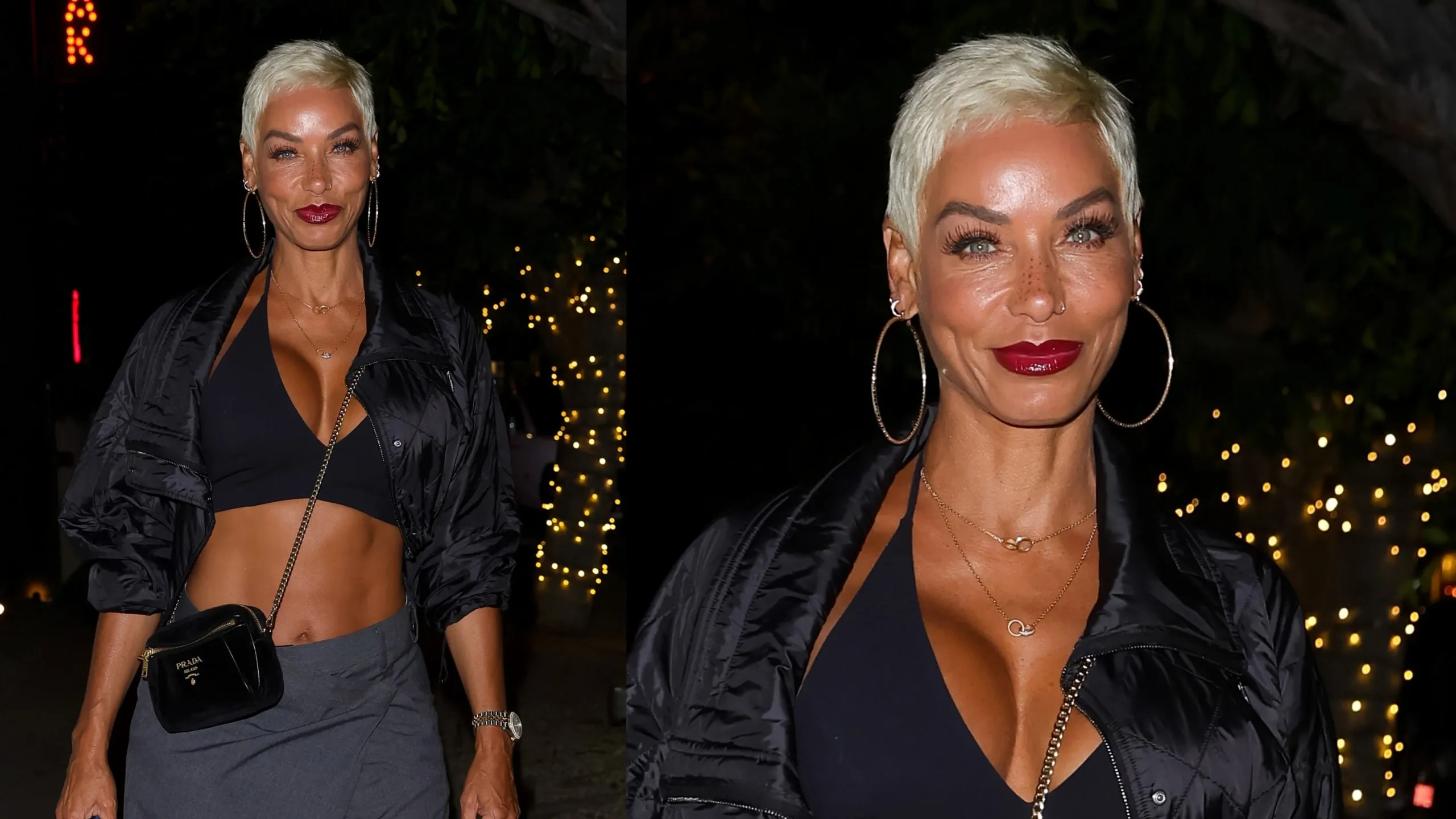 Wearing a black coat and pants, Nicole Murphy smiles for paparazzi outside of a steakhouse in LA