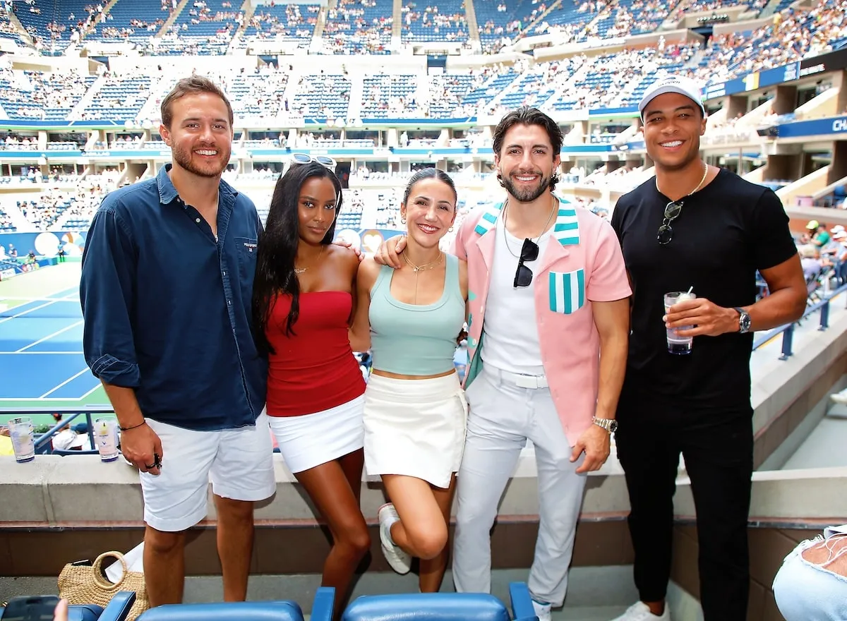 Reality tv stars Peter Weber, Ciara Miller, Kat Stickler, Jason Tartick, and Dale Moss stand together in the stands at the U.S. Open