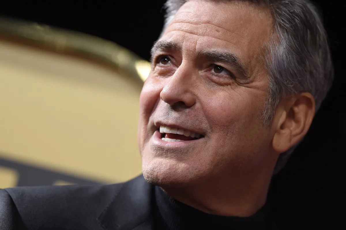 George Clooney smiling at the premiere of 'Hail, Ceaser'.