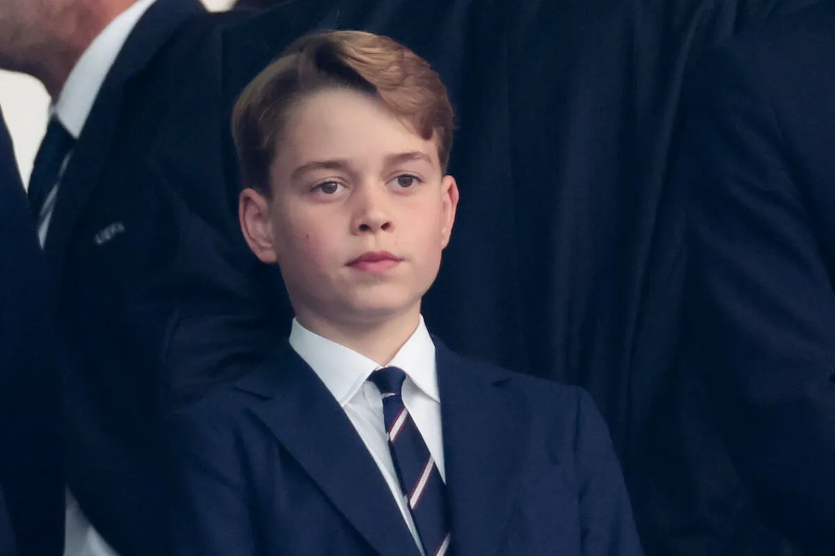 Prince George, who may go stag shooting at Balmoral, in the summer of 2024 wearing a suit and tie.