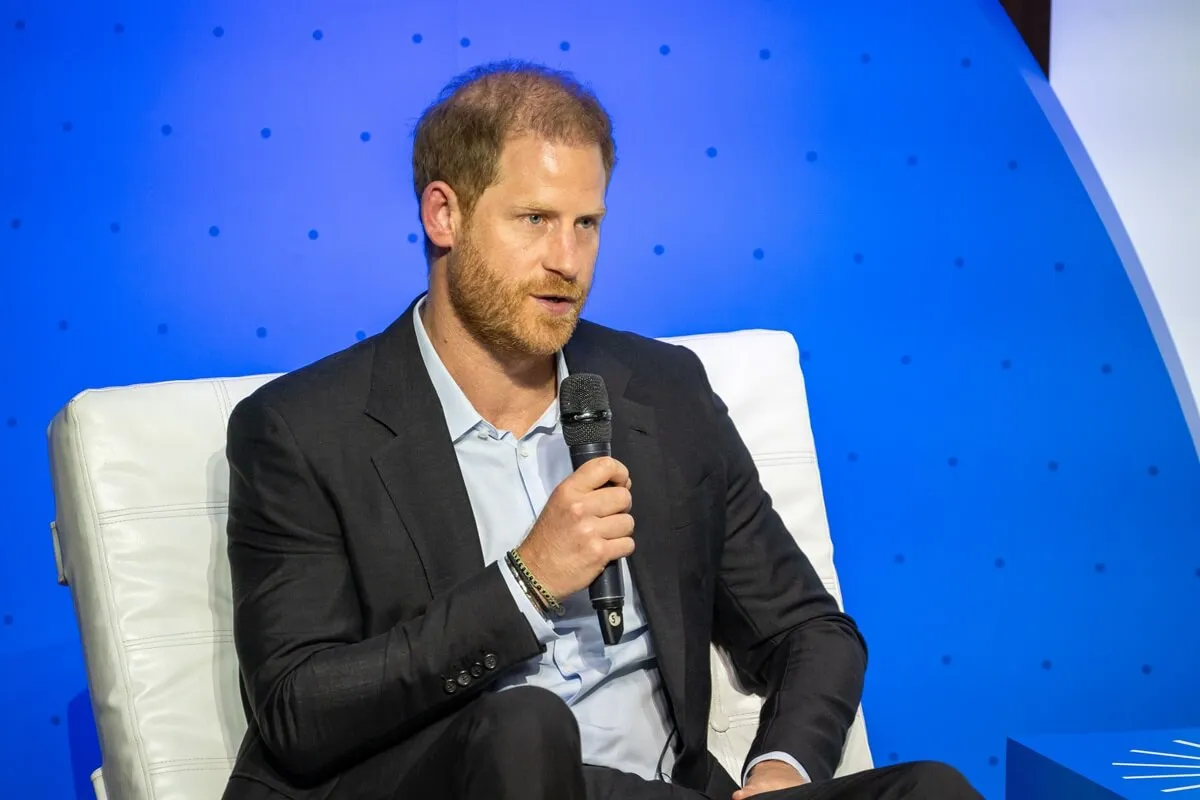 Prince Harry speaks onstage at a forum about digital responsibility at EAN University during a visit around Colombia