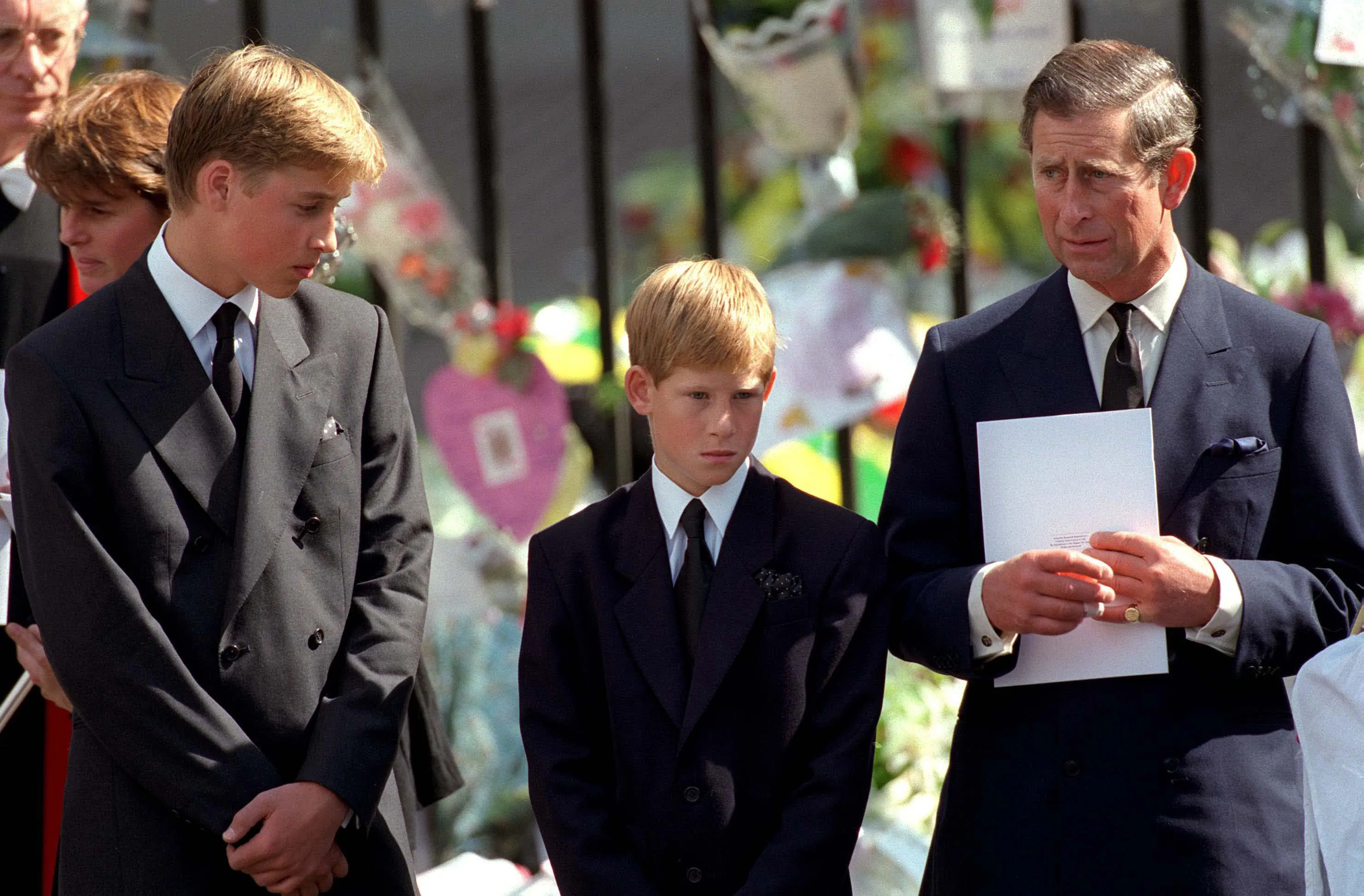 Prince William, Prince Harry, and then-Prince Charles outside Westminster Abbey at the funeral of Princess Diana