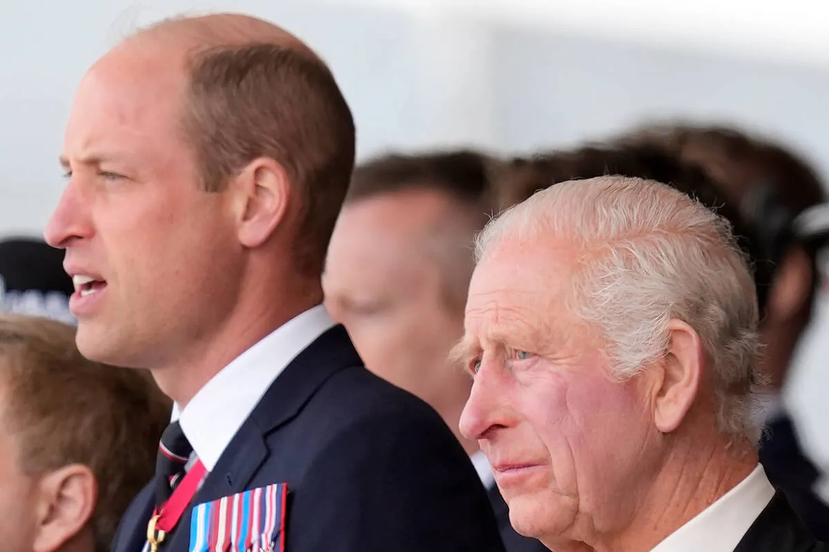 Prince William and King Charles, whom a royal author says Prince Harry may have to ask for money later, look on