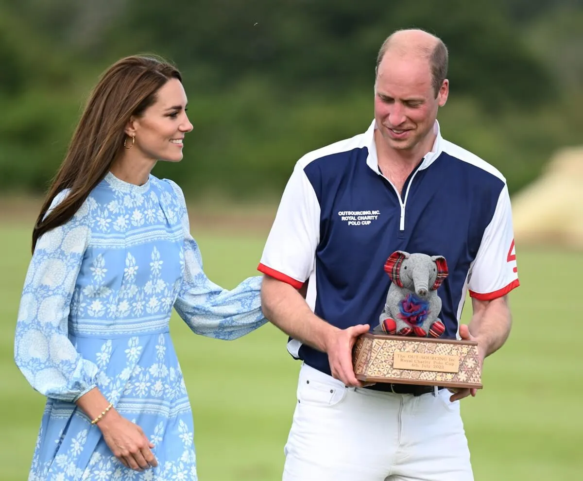 Prince William holds trophy alongside Kate Middleton at the Out-Sourcing Inc. Royal Charity Polo Cup 2023 at Guards Polo Club