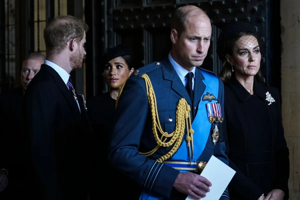 Prince Harry and Meghan Markle walk behind Prince William and Kate Middleton during Queen Elizabeth II's funeral