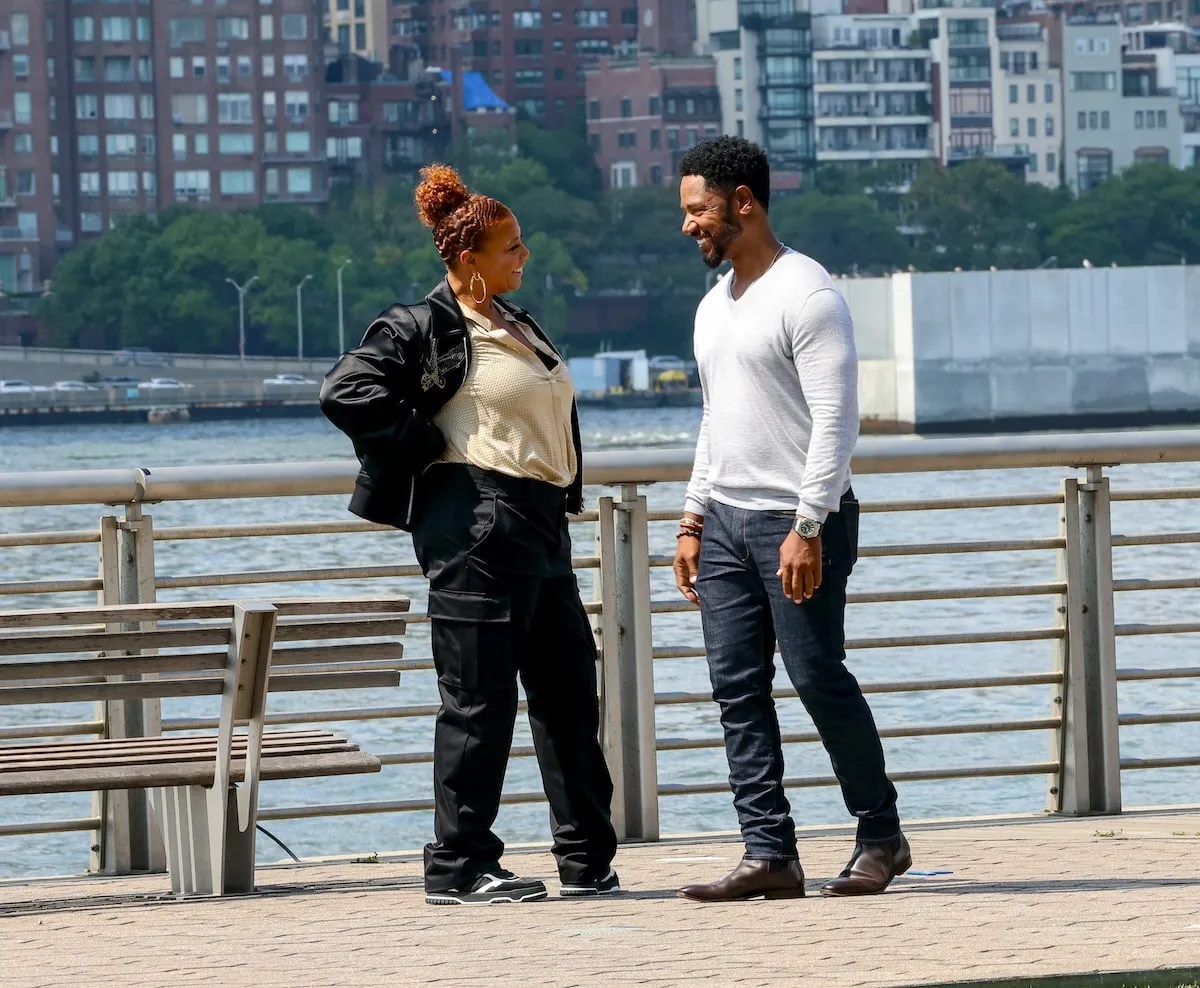 Tory Kittles and Queen Latifah film a scene for The Equalizer on Long Island City, Queens, with the NYC skyline behind them