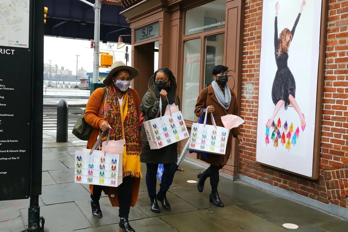 Customers leave the Sarah Jessica Parker shoe store on February 27, 2021 in New York City.