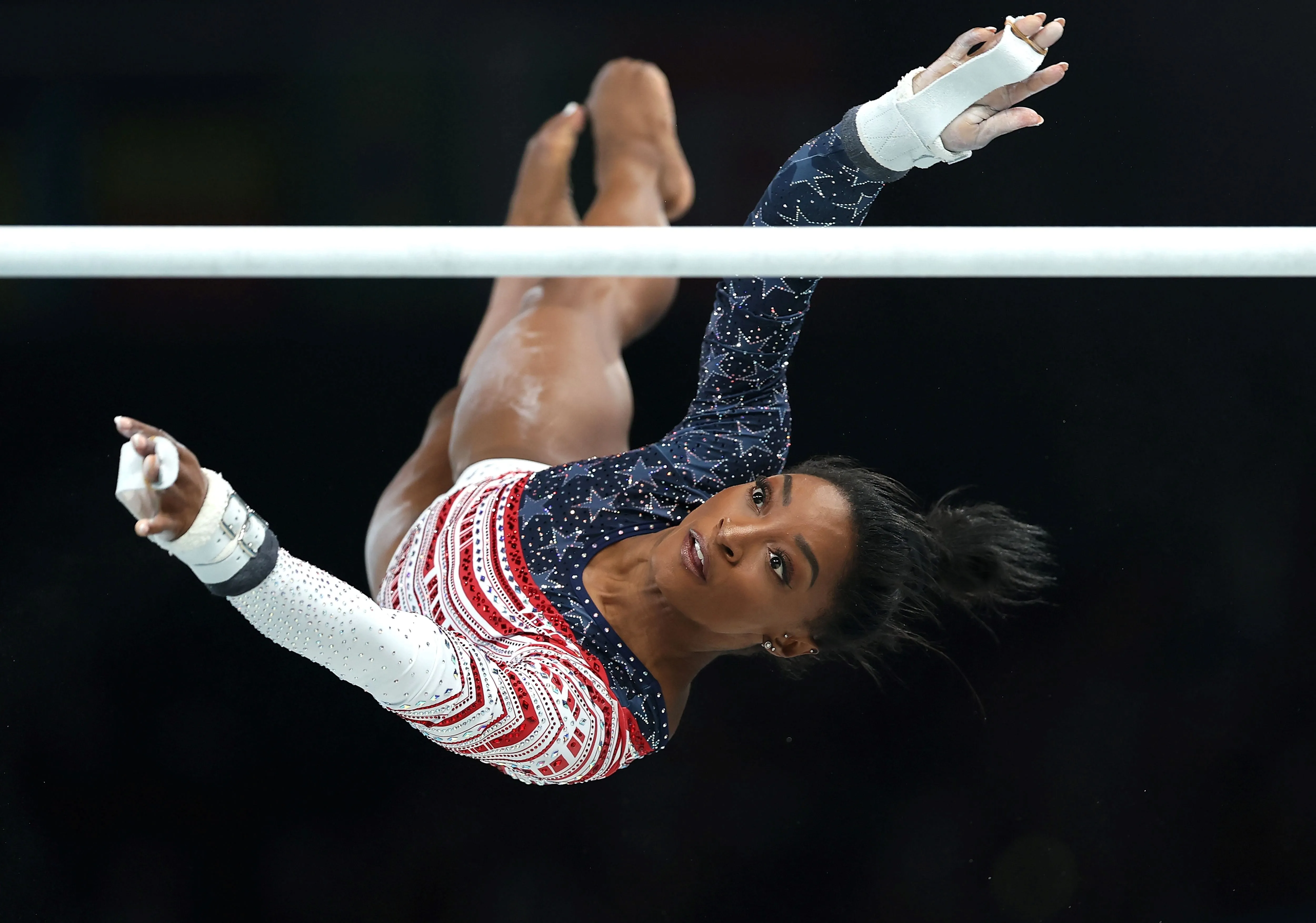 Gymnast Simone Biles of the United States competes on the uneven bars