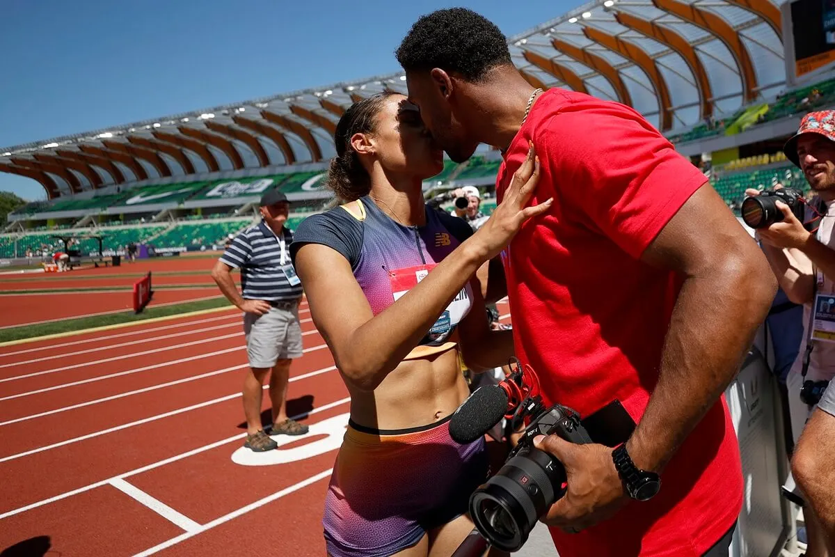 Sydney McLaughlin kisses husband Andre Levrone Jr. after she broke a world record