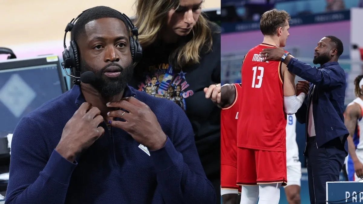 Former NBA player Dwyane Wade wears headphones courtside while Team USA competes in the Olympics