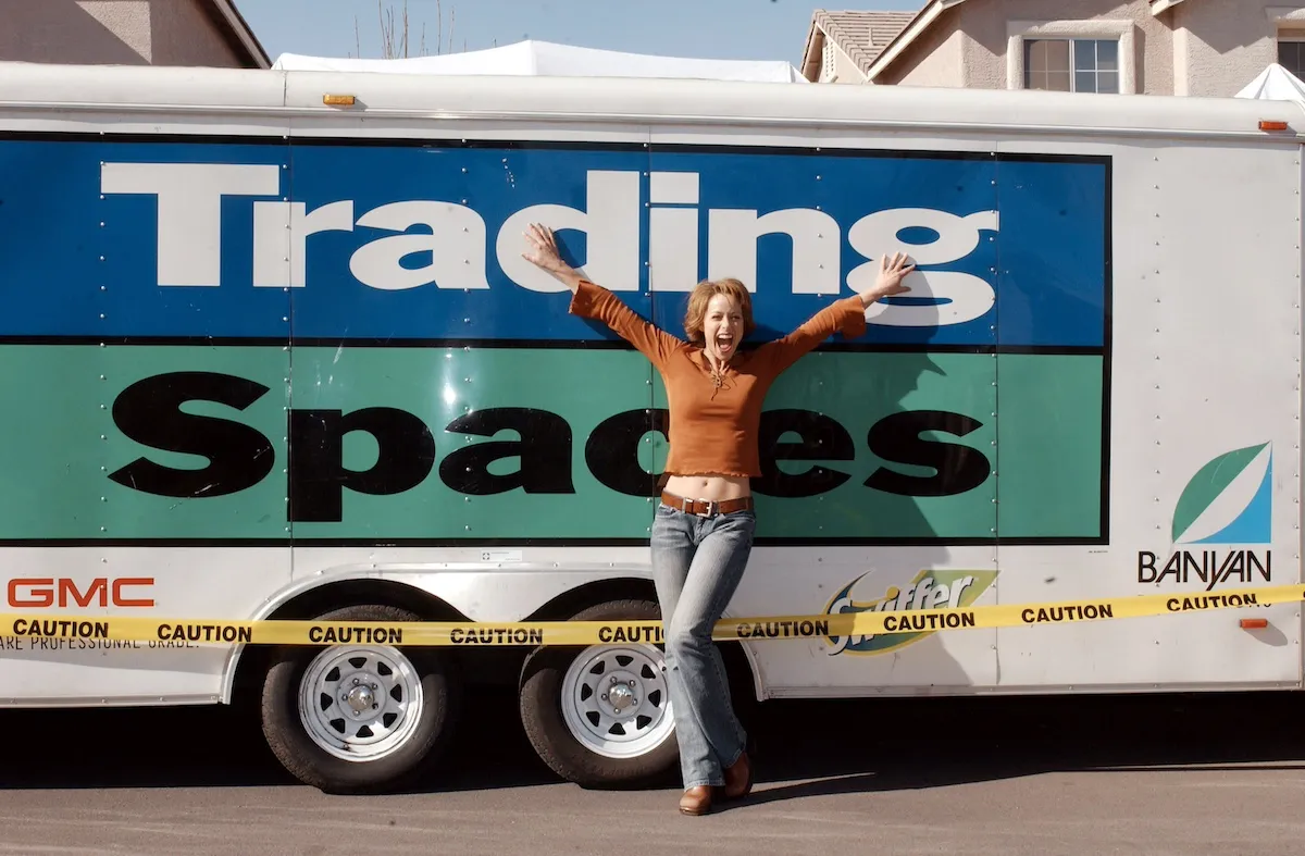 Paige Davis strikes an excited pose in front of the 'Trading Spaces' van.