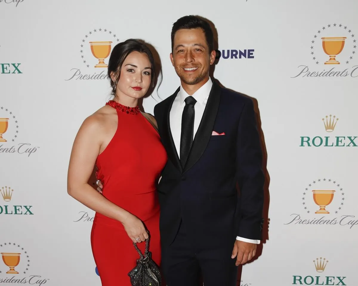 Xander Schauffele and Maya Lowe walk the red carpet prior to Presidents Cup at The Royal Melbourne Golf Club