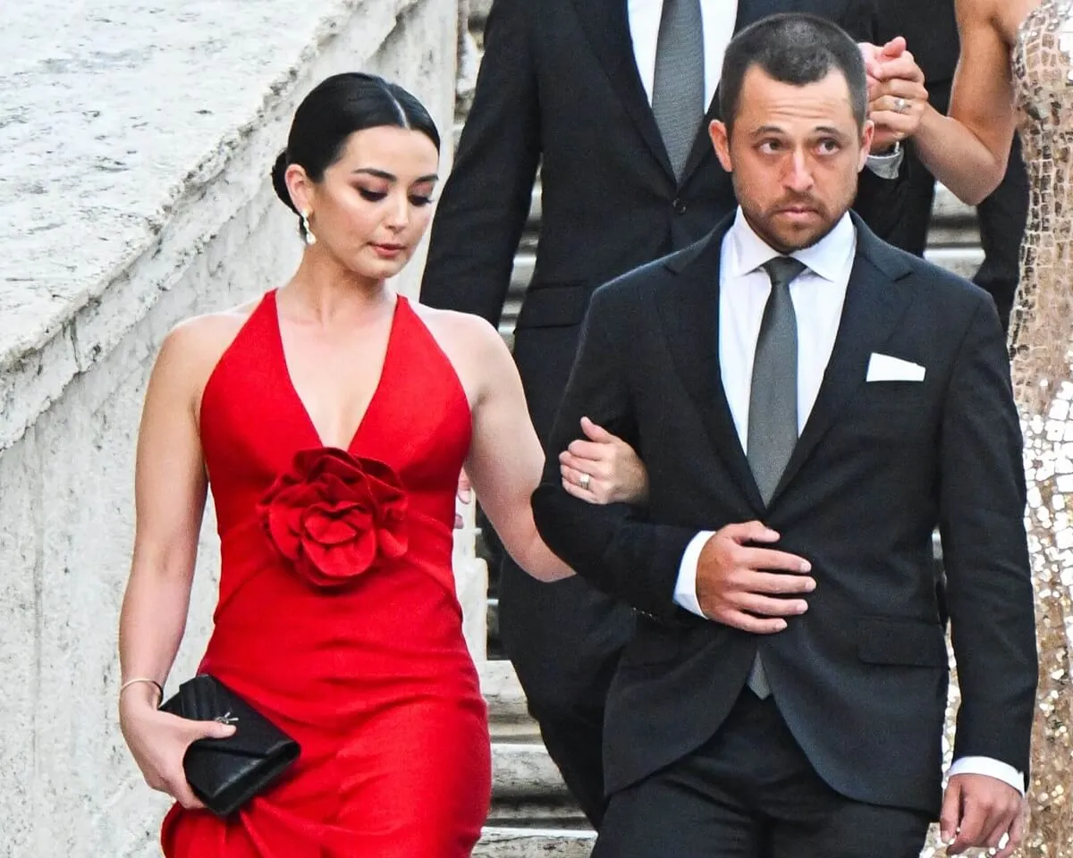 Xander Schauffele and his wife, Maya Lowe, arrive for a photo call on the Spanish Steps prior to a gala for the Ryder Cup