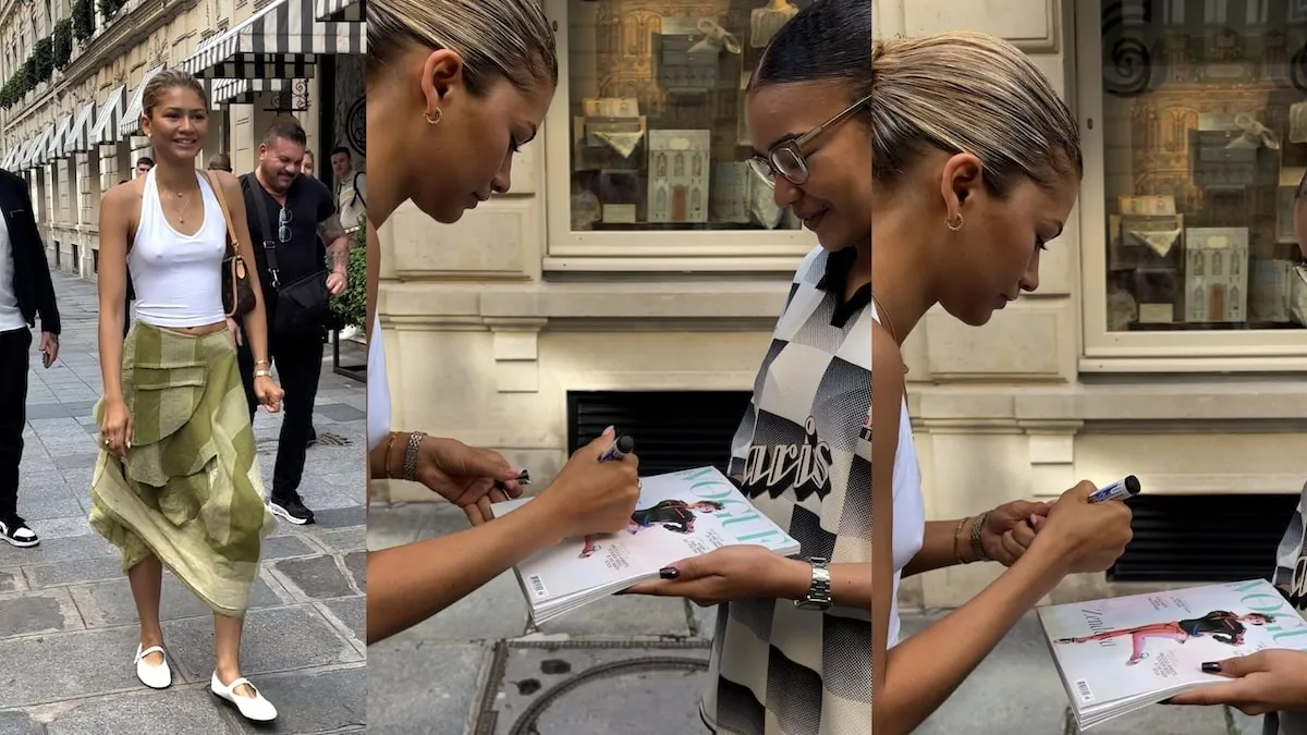 Wearing a white top and green skirt, Zendaya greets paparazzi and signs autographs outside of her Paris hotel