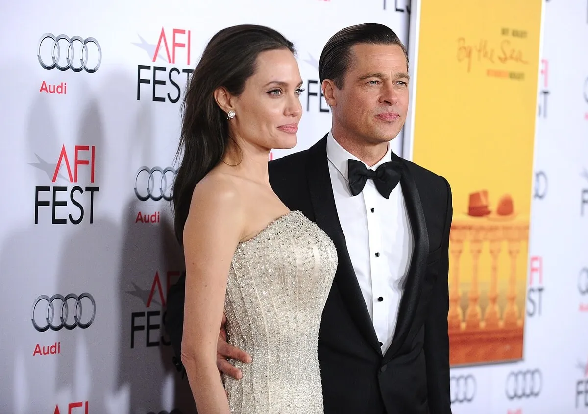 Angelina Jolie and Brad Pitt posing at the premiere of "By the Sea".