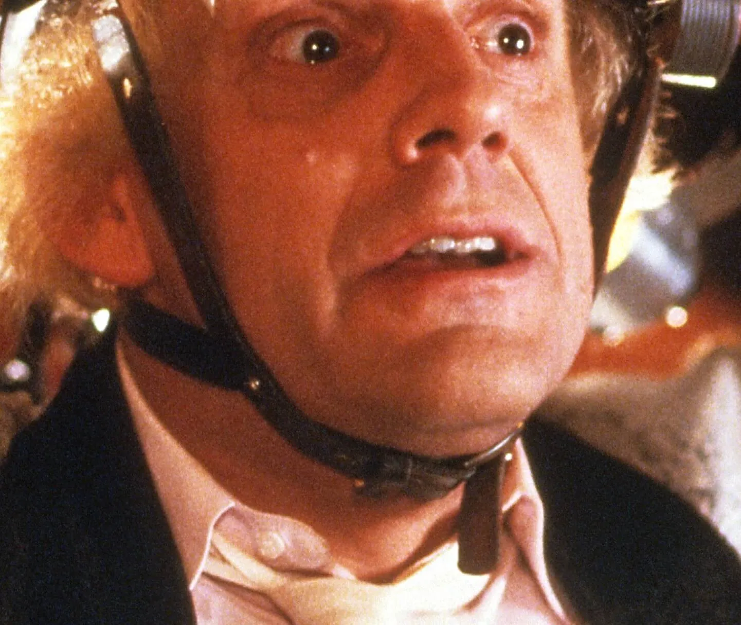 Christopher Lloyd wearing a helmet in 'Back to the Future'