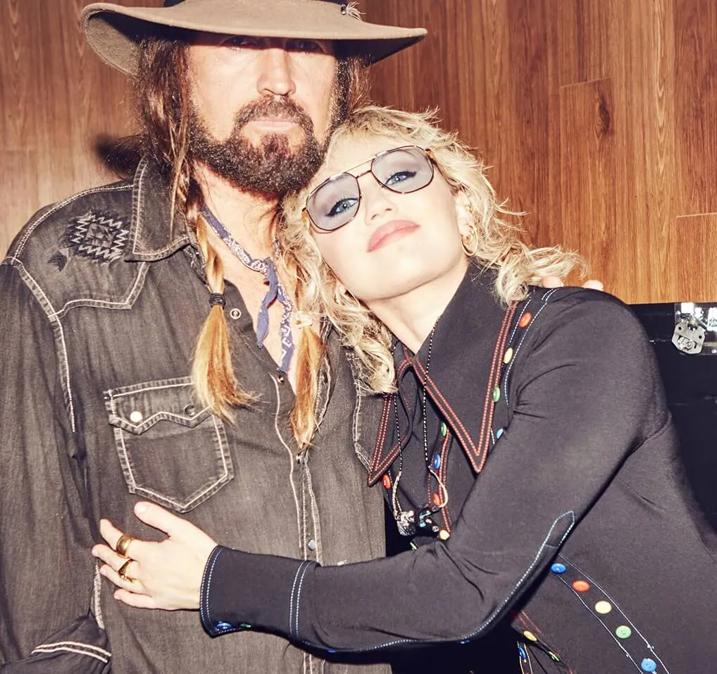 Billy Ray Cyrus and Miley Cyrus hugging