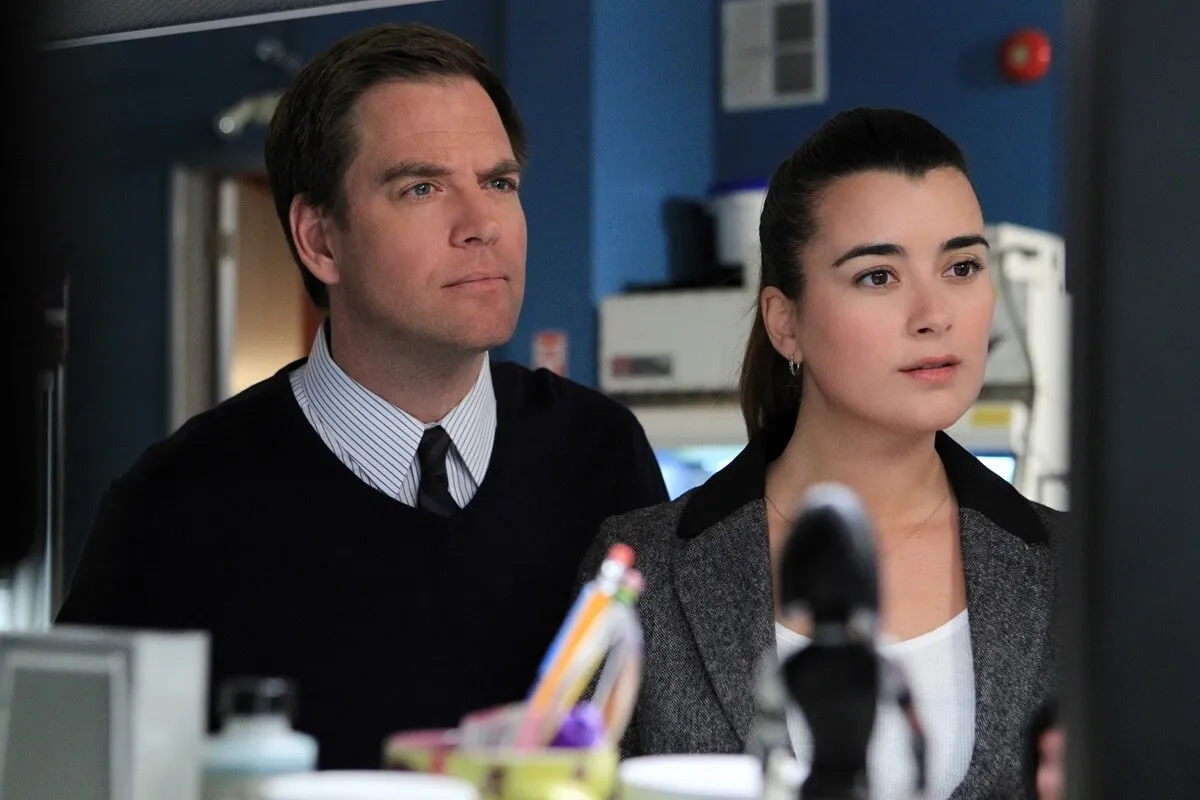 Cote de Pablo standing next to Michael Weatherly in an episode of 'NCIS'.