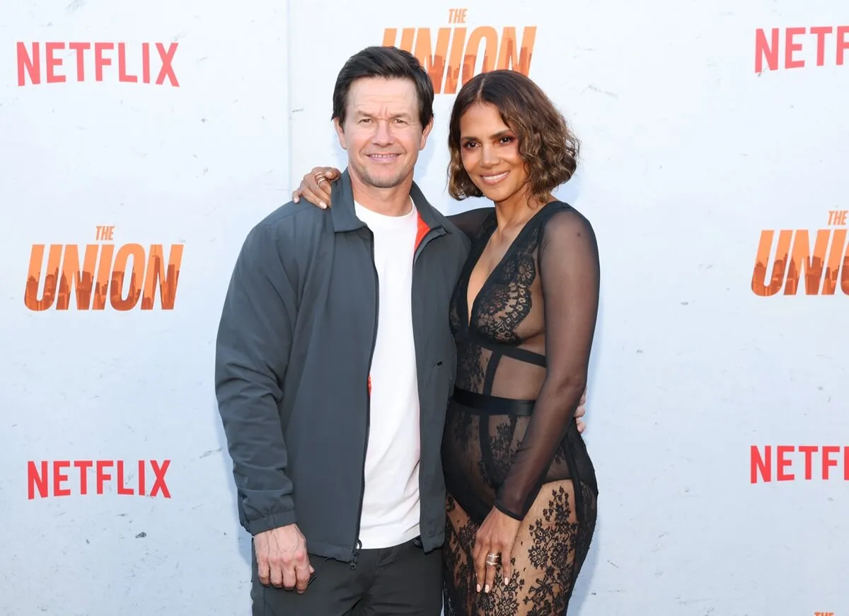 Halle Berry and Mark Wahlberg holding each other at the premiere of 'The Union'.