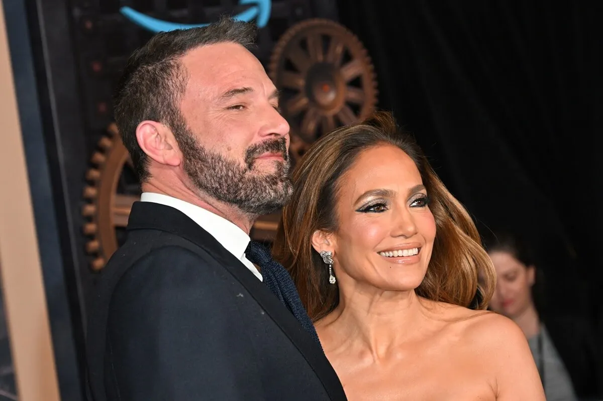 Jennifer Lopez and Ben Affleck posing while dressed up at the premiere of "This is Me... Now: A Love Story".