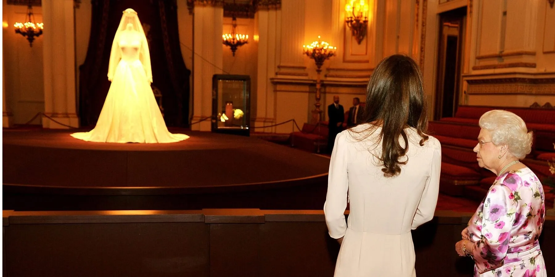 Kate Middleton and Queen Elizabeth look at wedding dress on display