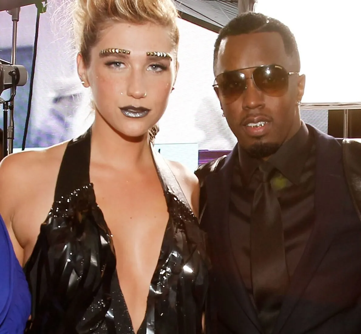 Kesha and Sean "Diddy" Combs wearing black