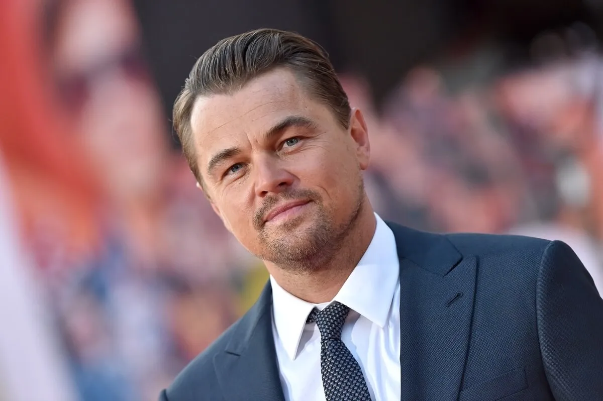 Leonardo DiCaprio posing at the premiere of 'Once Upon a Time in Hollywood..' in a suit.