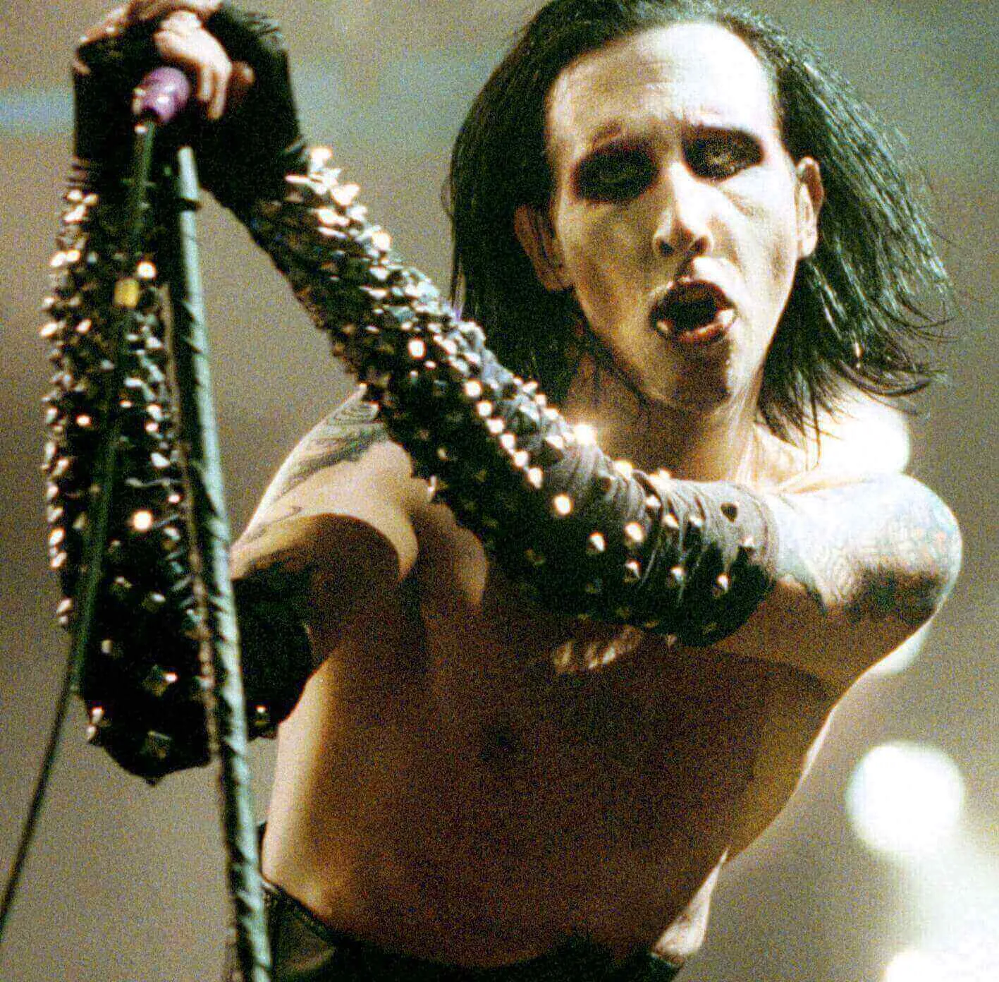 "As Sick As the Secrets Within" star Marilyn Manson with a microphone
