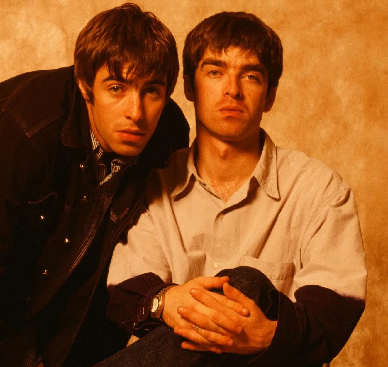 Oasis' Liam and Noel Gallagher staring at the camera