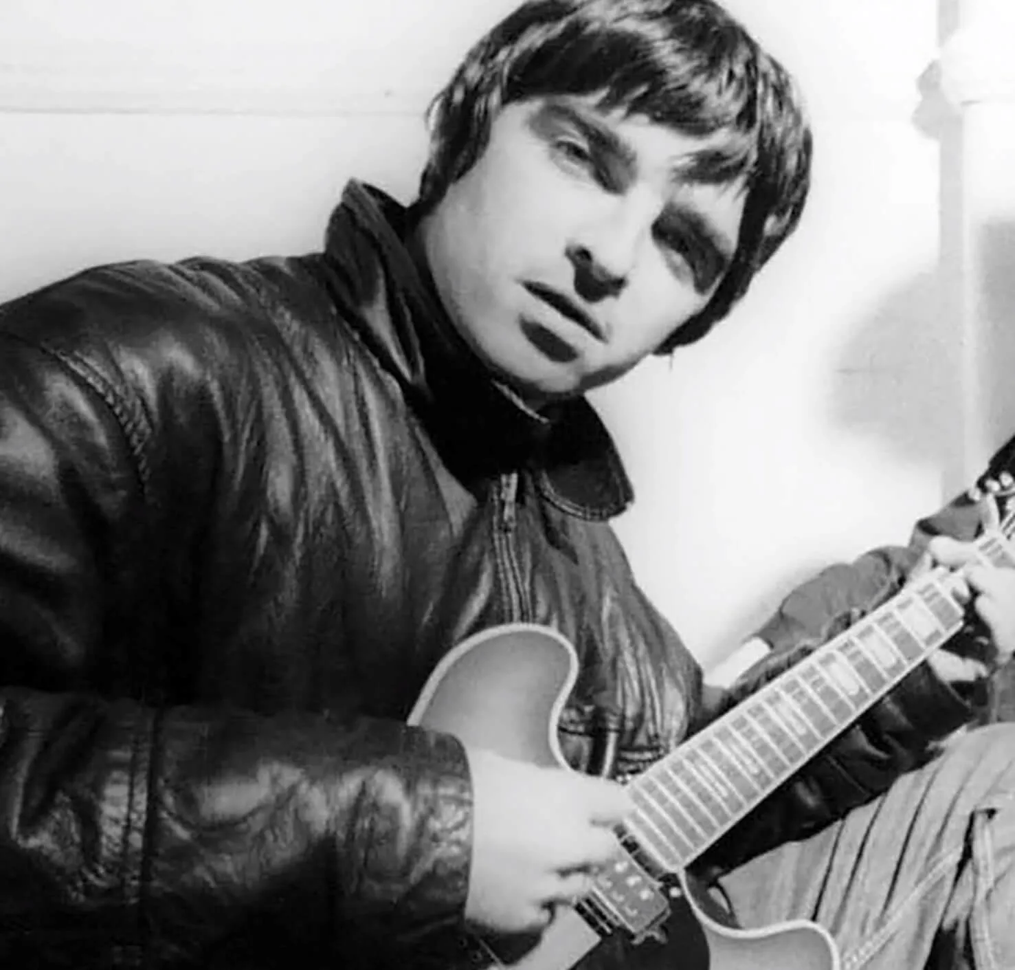 Oasis' Noel Gallagher with a guitar