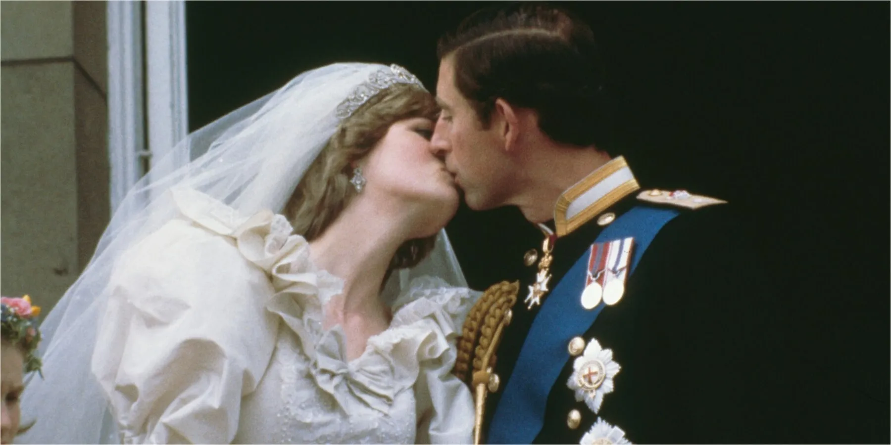 Princess Diana and then-Prince Charles kiss on the Buckingham Palace balcony in July 1981.