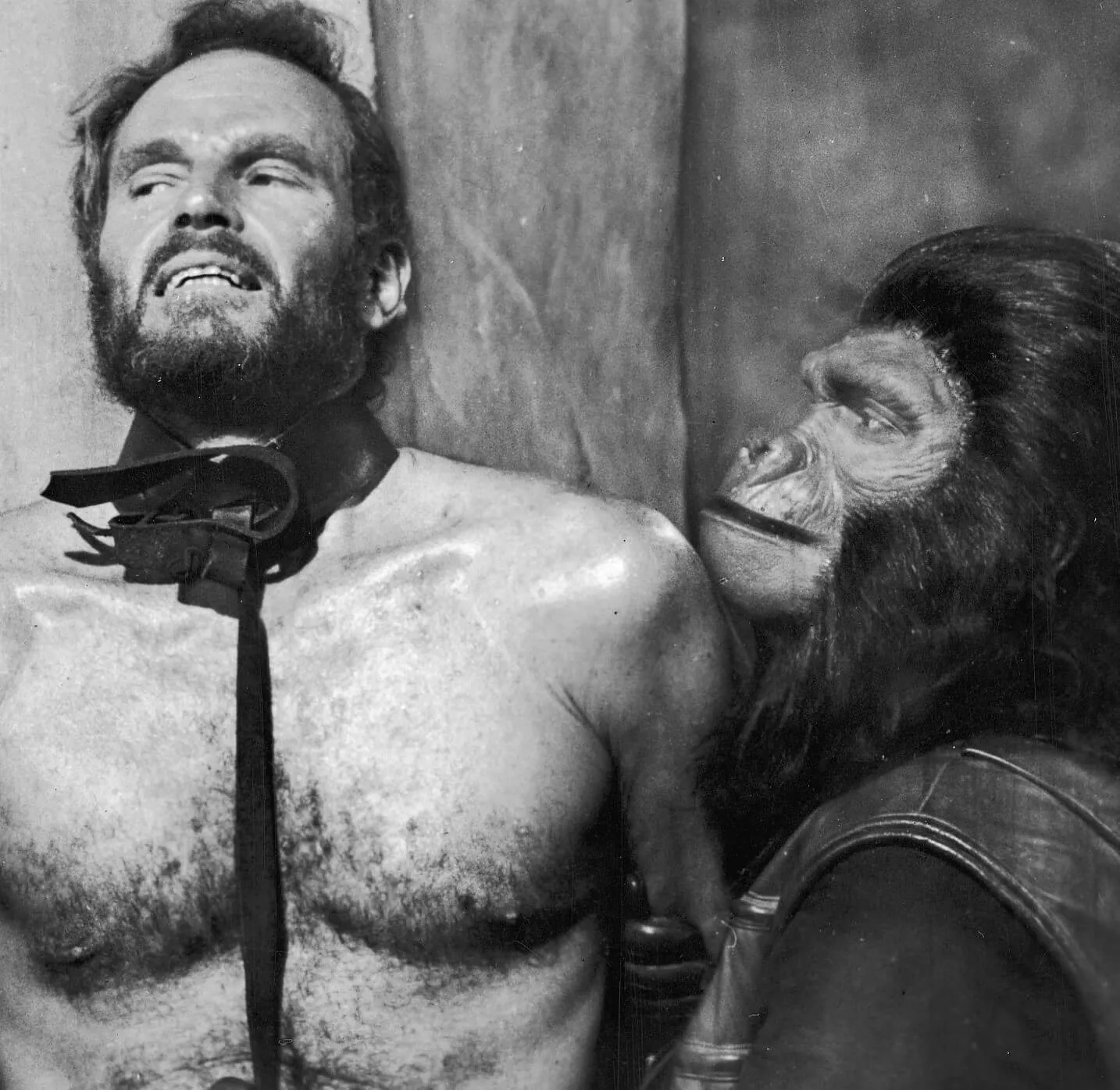 A black-and-white promotional image for 'Planet of the Apes'