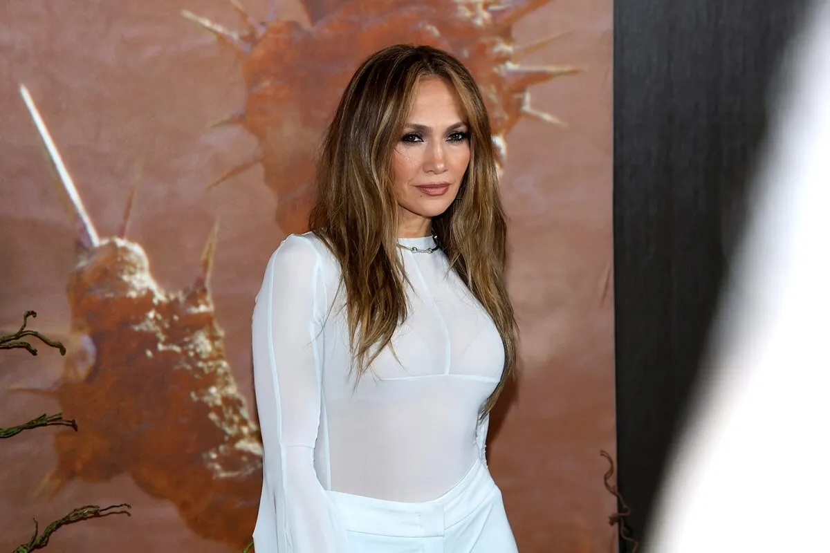 Jennifer Lopez posing while wearing a white outfit at the 'Atlas' photocall.