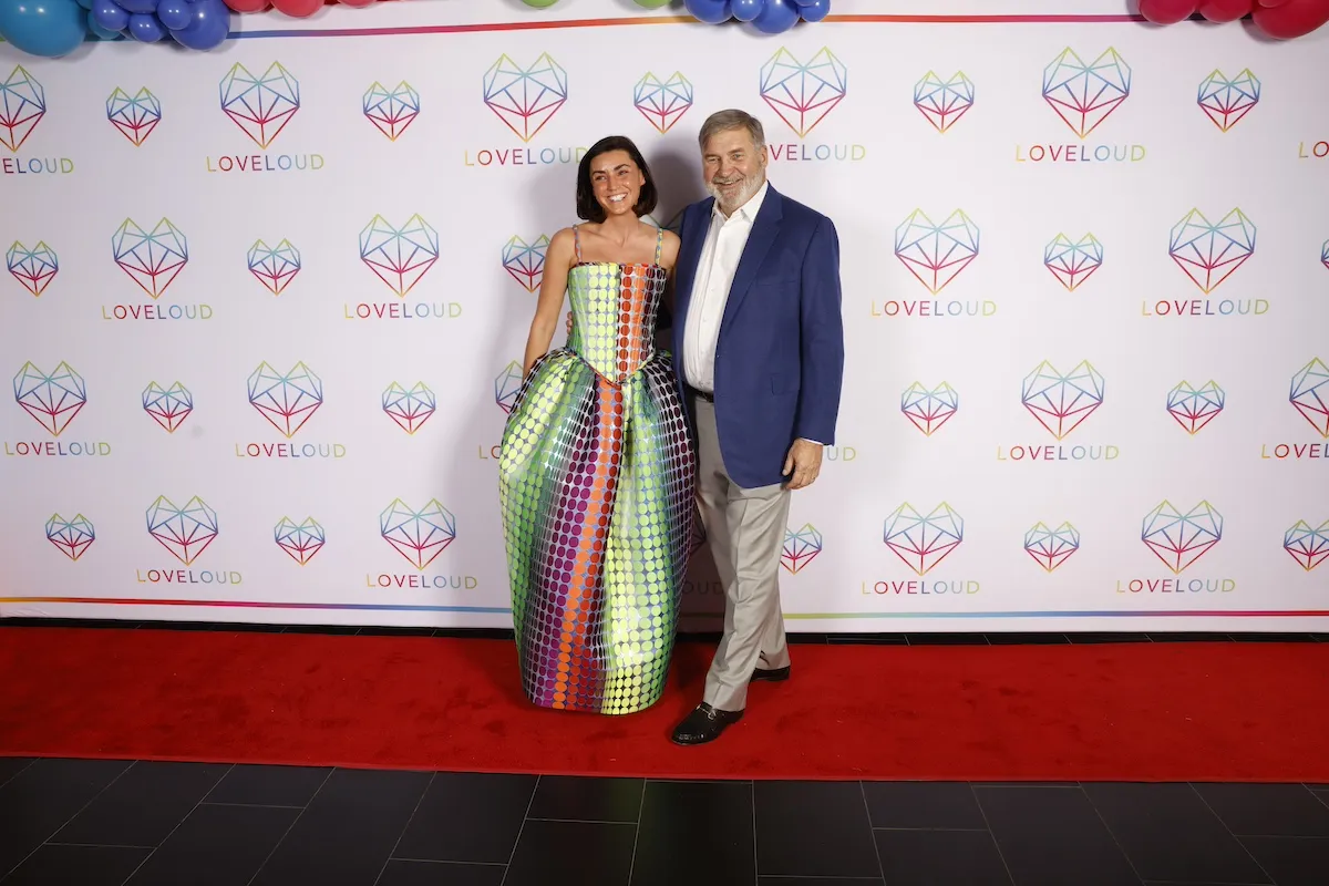 Bronwyn Newport and Todd Bradley pose on the red carpet at an event