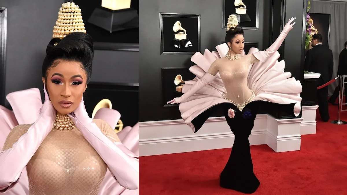 Rapper Cardi B wears a pink and black Mugler gown while posing for photographers on the red carpet at the 2019 Grammy Awards