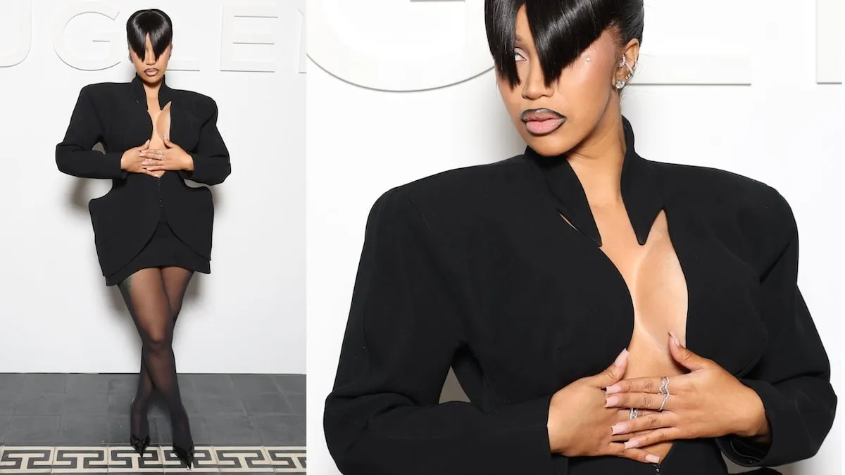 Wearing a black mini dress and blunt bangs, Cardi B poses for photographers before the Mugler spring/summer show 2025 fashion show in Paris