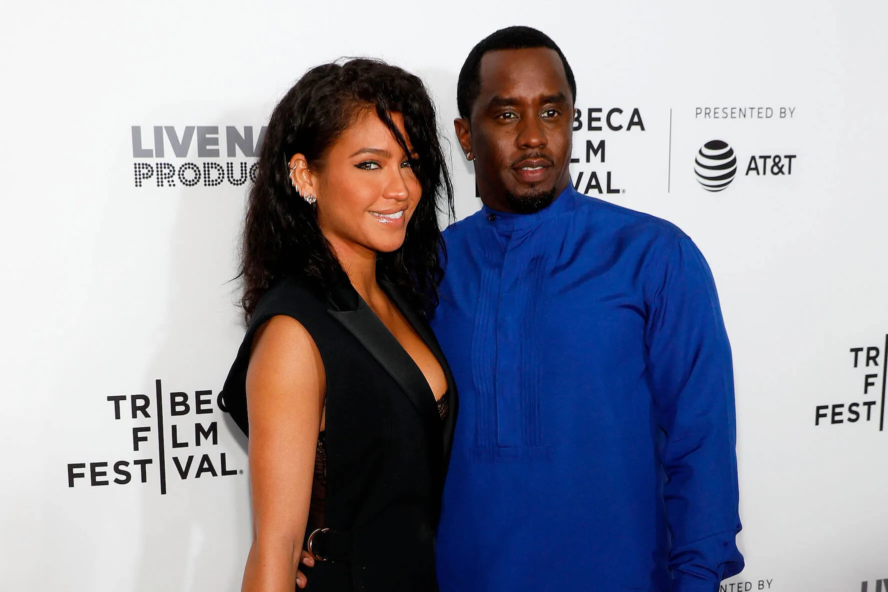 Casandra 'Cassie' Ventura and Sean 'P. Diddy' posing together and smiling at a film screening